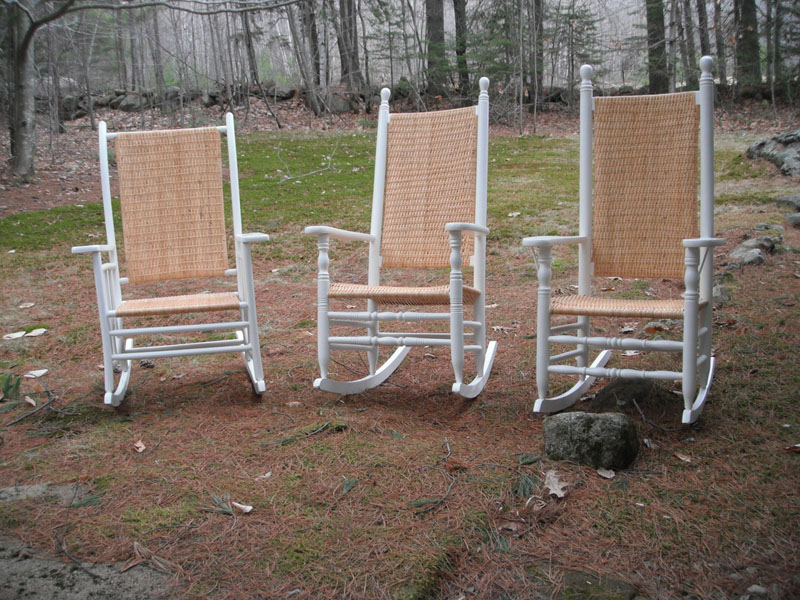 photo of rocking chair with cane seat and white frame